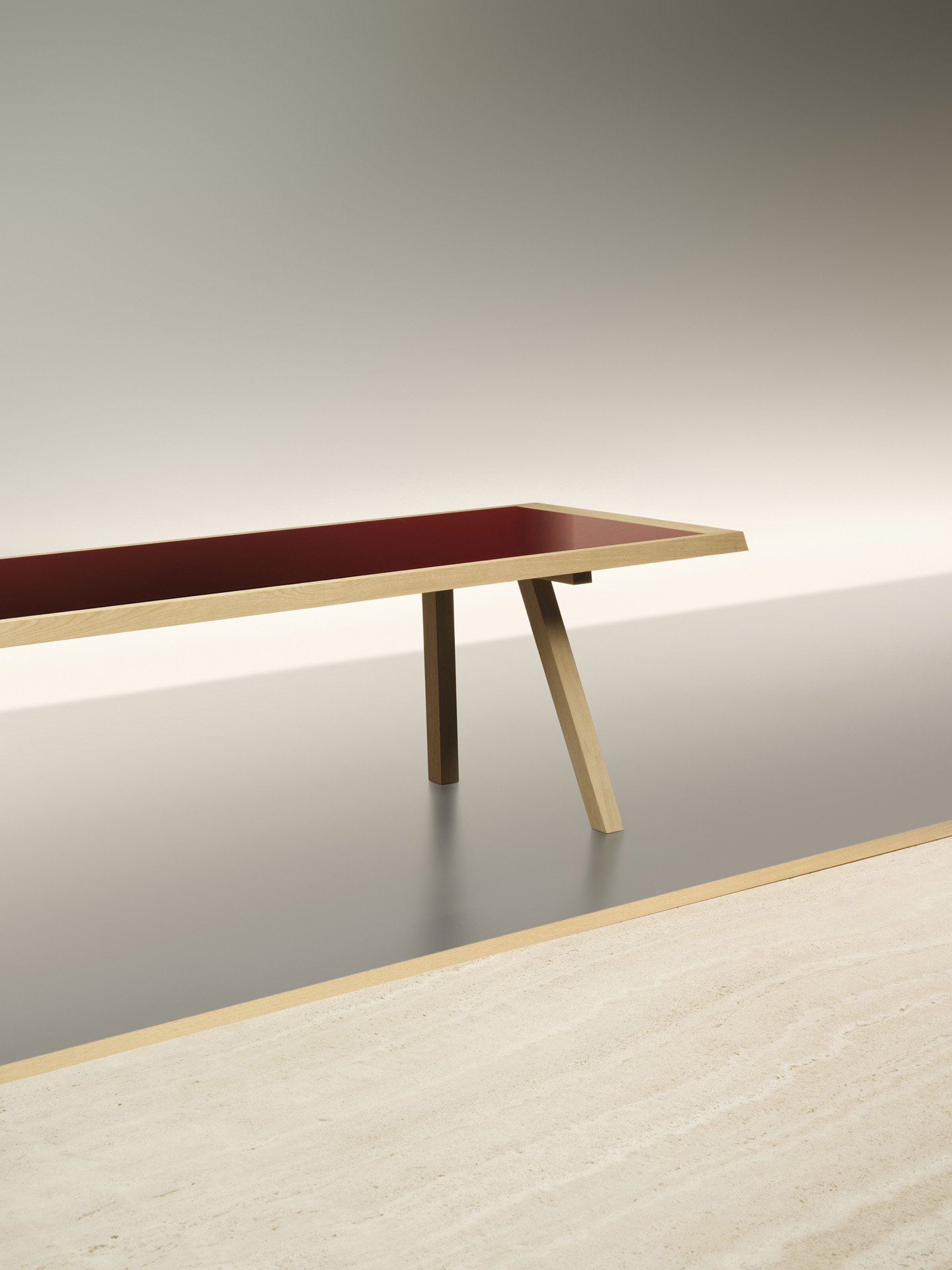 In the foreground: table with oak frame and travertine insert; in the background: table with oak frame and coloured glass insert | Ph. Alberto Strada