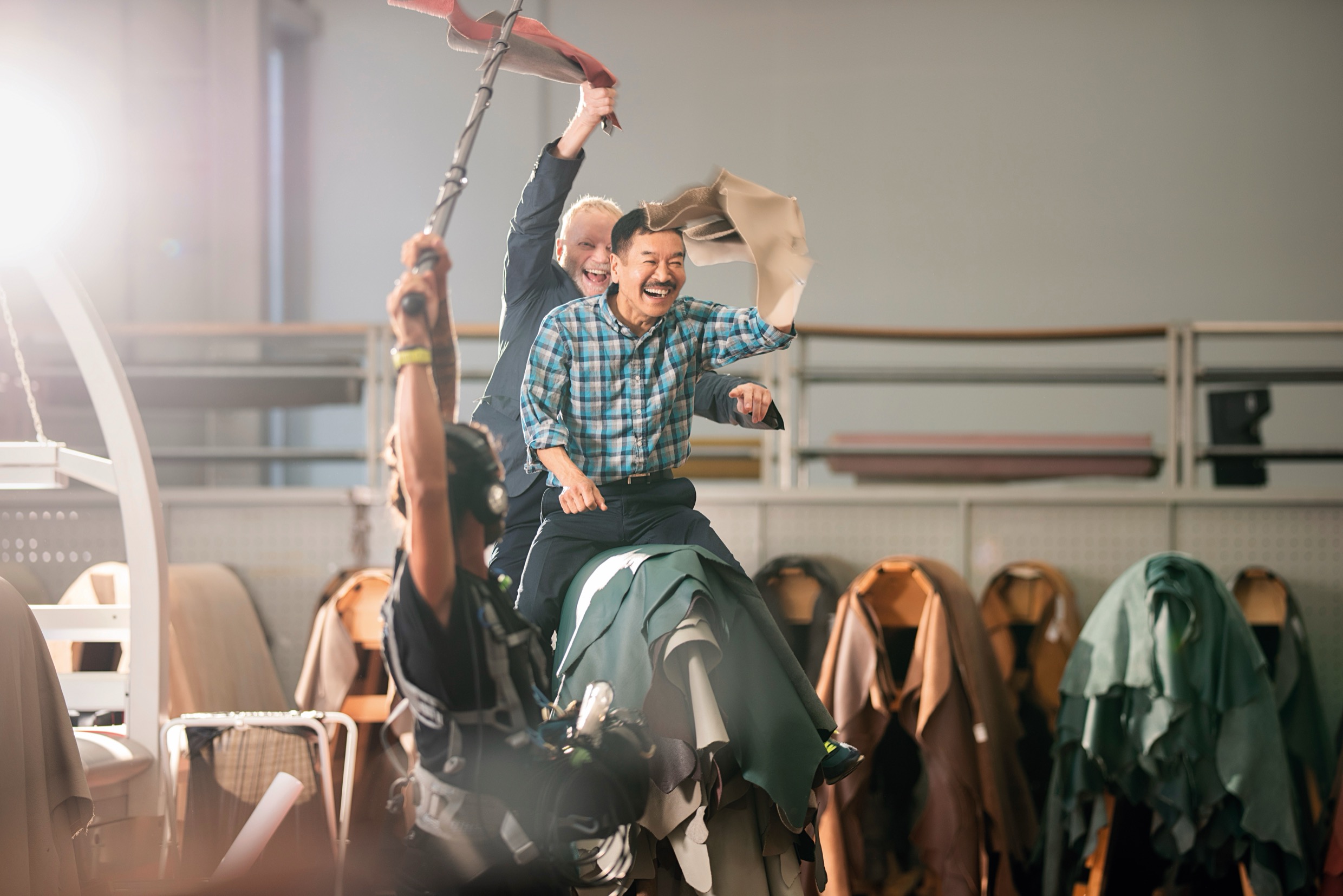 George Yabu and Glenn Pushelberg goofing around in the leather workshop. Ph. Jeff Burton, from Molteni Mondo by Rizzoli NY, 2024